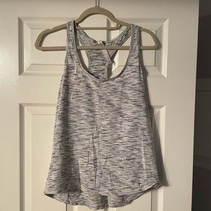 Lululemon running top. Loose fitting. Heathered white. Excellent condition.